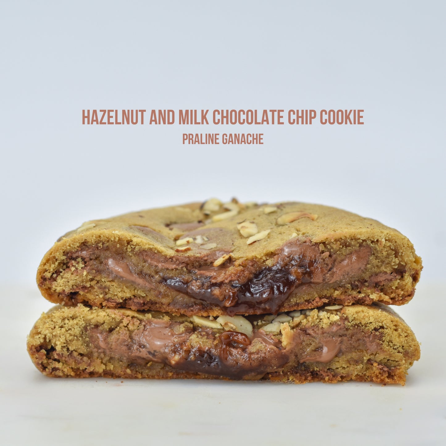 Hazelnut praline chocolate chip cookies 
Milk chocolate hazelnut ganache-stuffed cookies 
Hazelnut and praline-filled chocolate chip cookies
Praline chocolate chip cookies with hazelnuts 
Hazelnut praline ganache cookie gift box 
Milk chocolate chip cookies with hazelnut praline ganache
Gourmet praline-stuffed hazelnut cookies 
Hazelnut praline ganache sandwich cookies 
Hazelnut chocolate ganache cookie assortment 
Hazelnut praline ganache cookies with milk chocolate chips 
Hazelnut and milk chocolate chip 